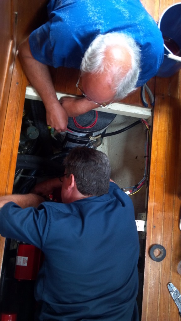 Chuck (top) and Dave (bottom) working on the engine aboard Astraea