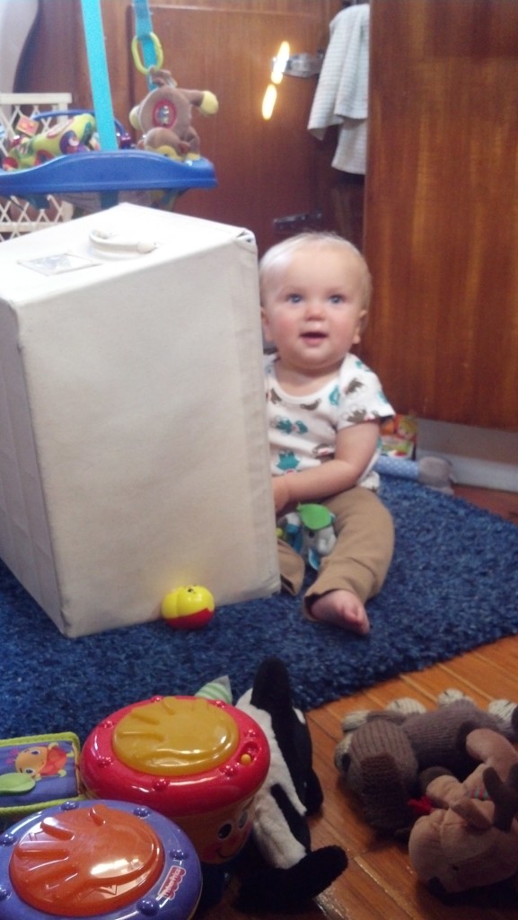 Sullivan playing with his empty toy box
