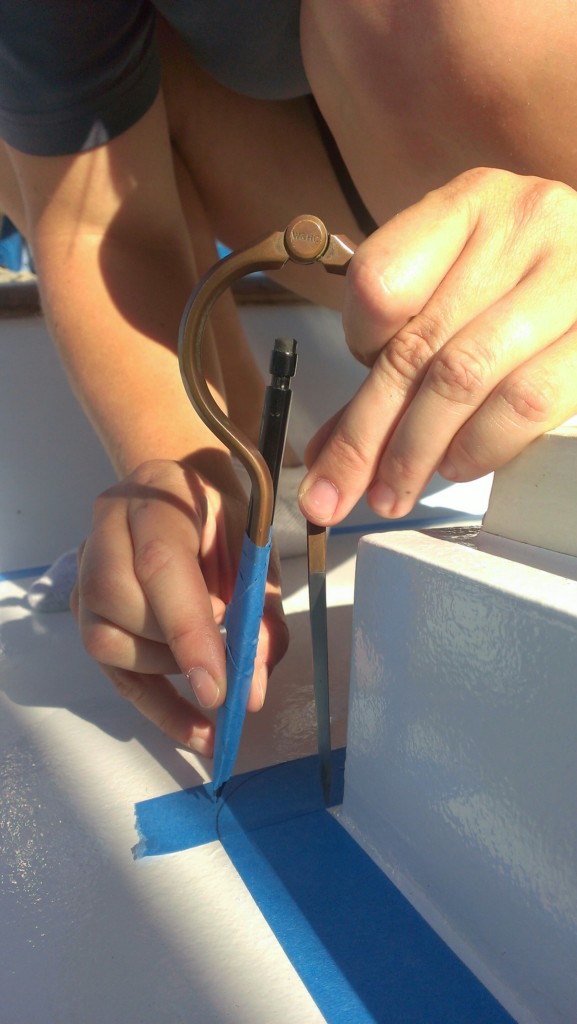 Using a compass to draw a curve on the tape